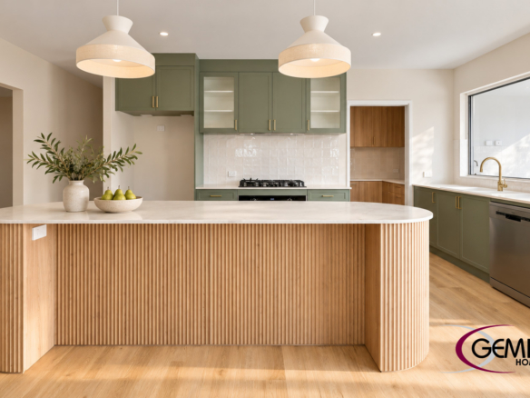 Gemini Homes kitchen with sage cabinetry, a curved timber island and pendant lighting